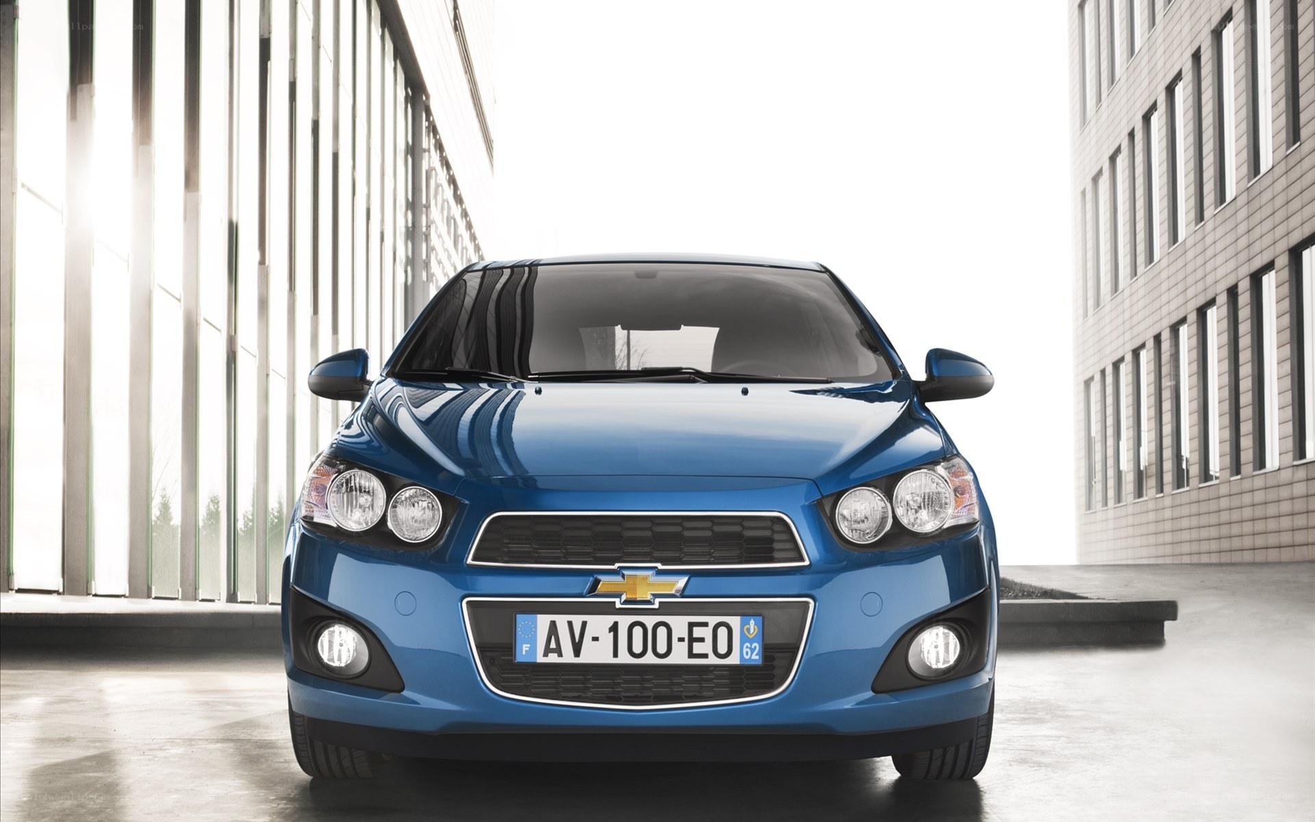Blue Chevrolet Aveo in urban setting