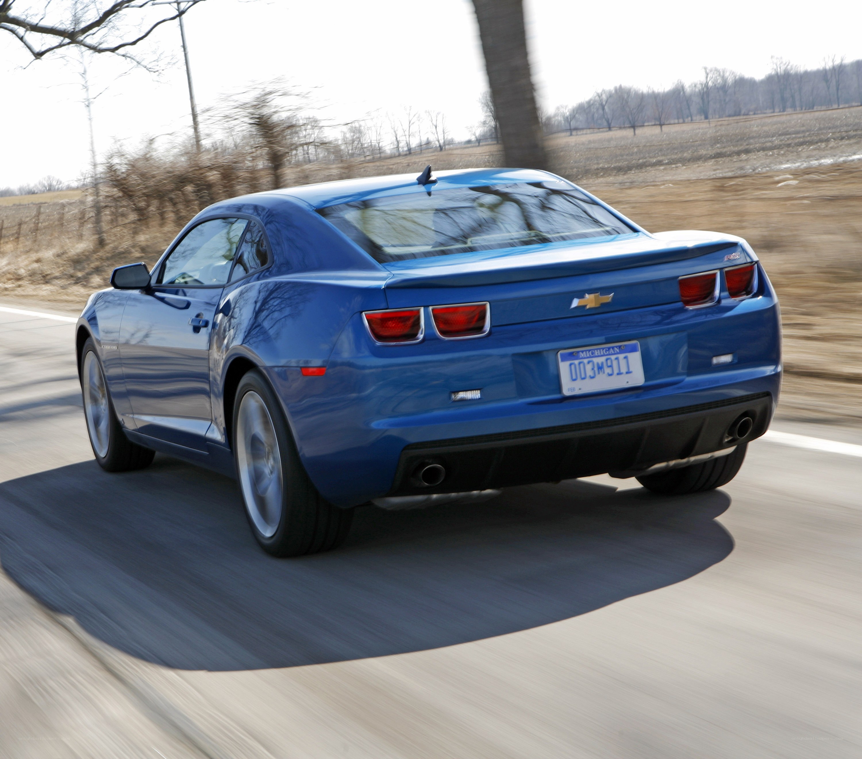 blue chevrolet camaro driving