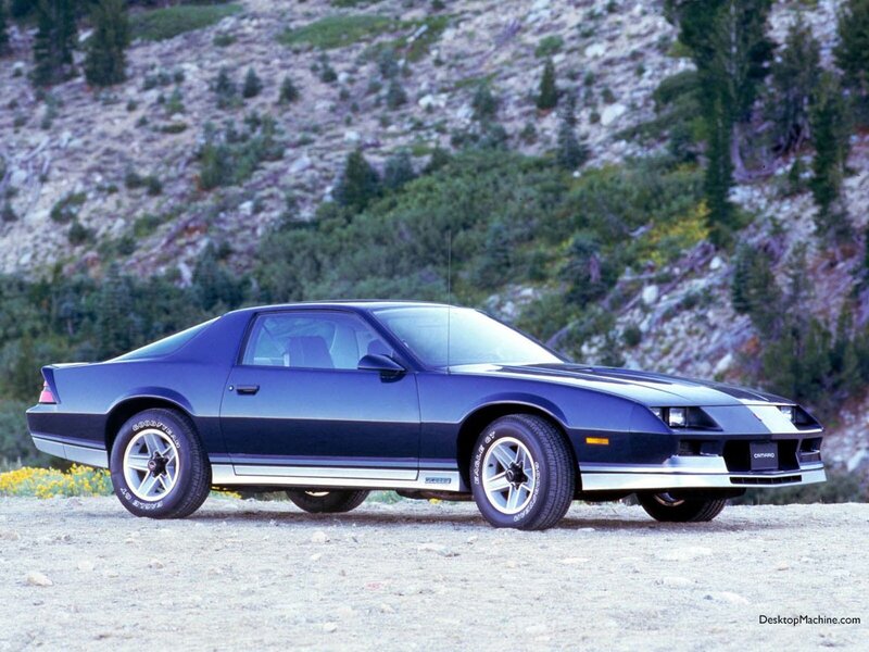 Blue Chevrolet Camaro in mountains