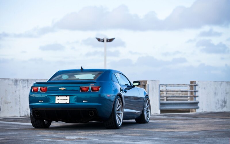 Blue Chevrolet Camaro on a pier
