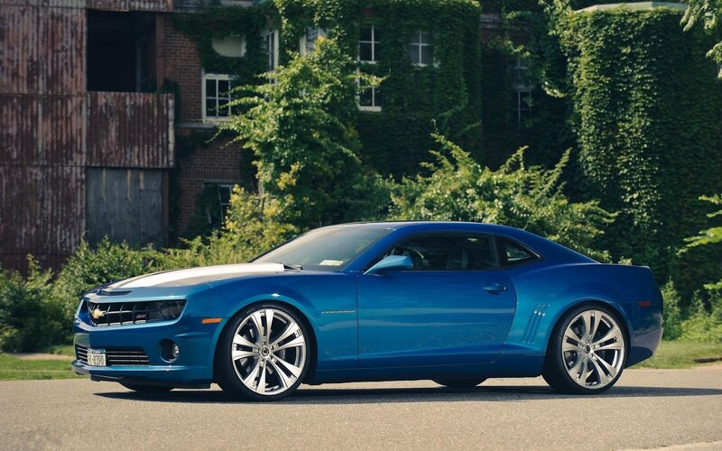 Blue Chevrolet Camaro on street
