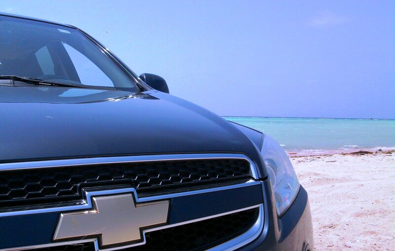 Blue Chevrolet on Beach