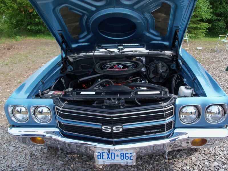 blue chevrolet ss with open hood