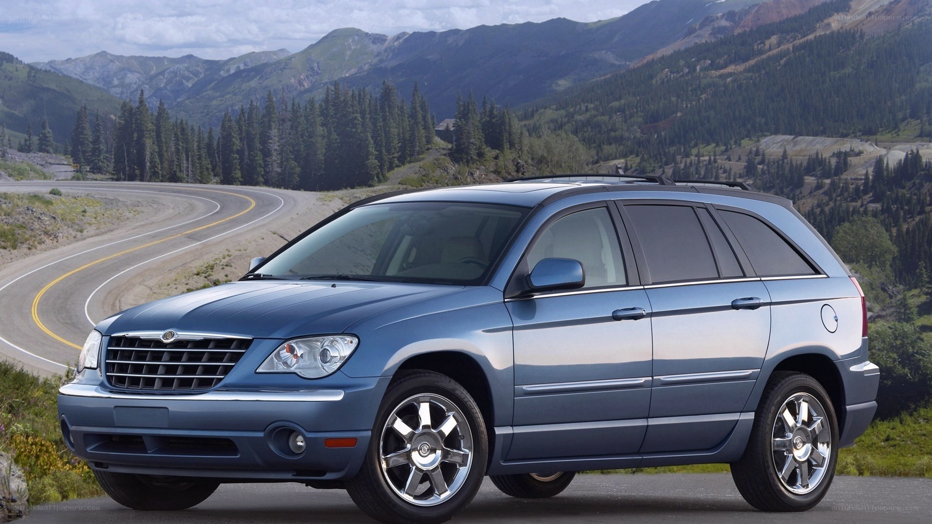 Blue Chrysler Pacifica on mountain road