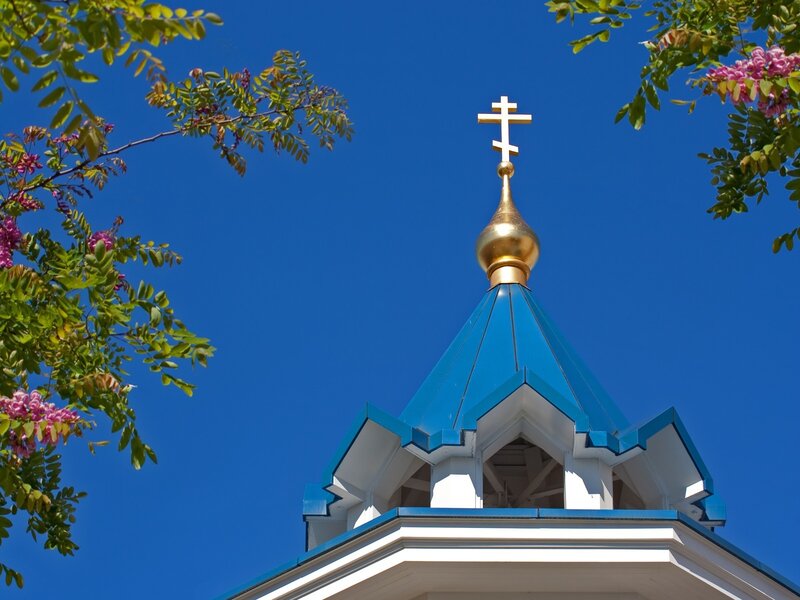 Blue church dome with golden cross