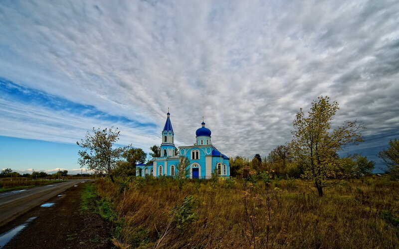 Blue Church in Field