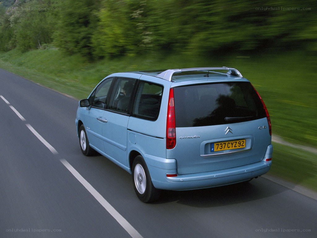blue citroen c8 driving on road