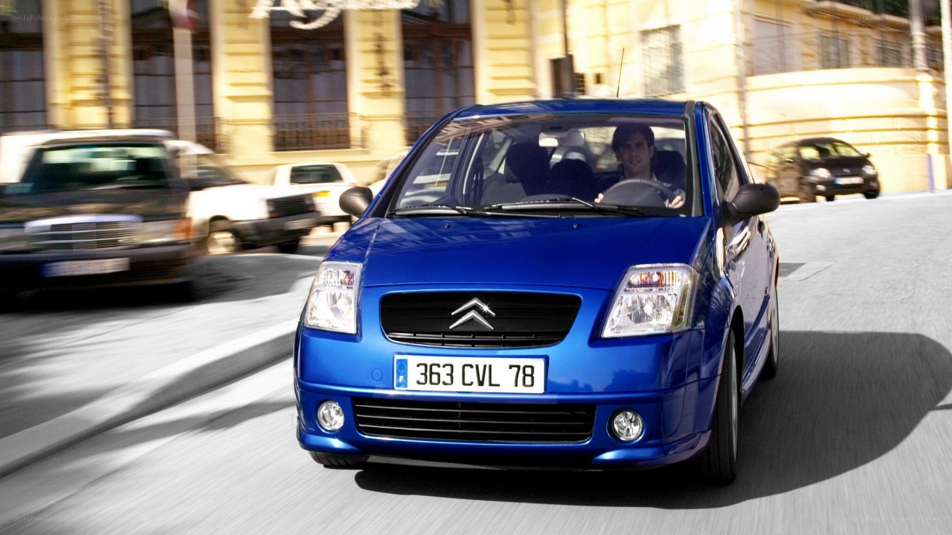 blue citroen car in motion