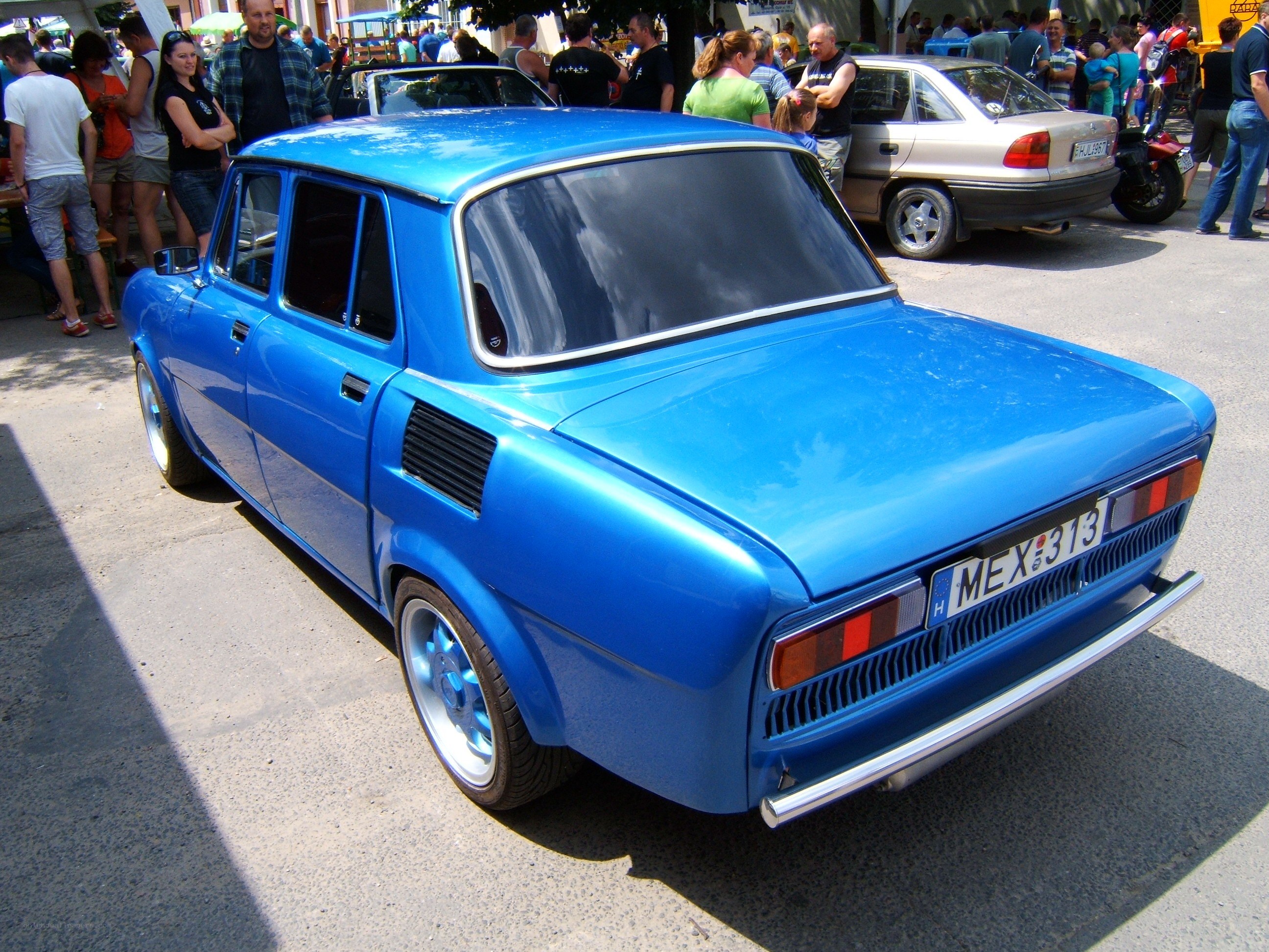 Blue classic car at a show