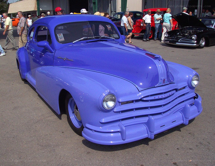 Blue classic car at a show