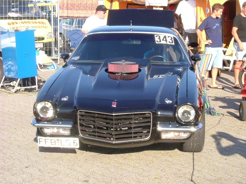 Blue classic car at a show