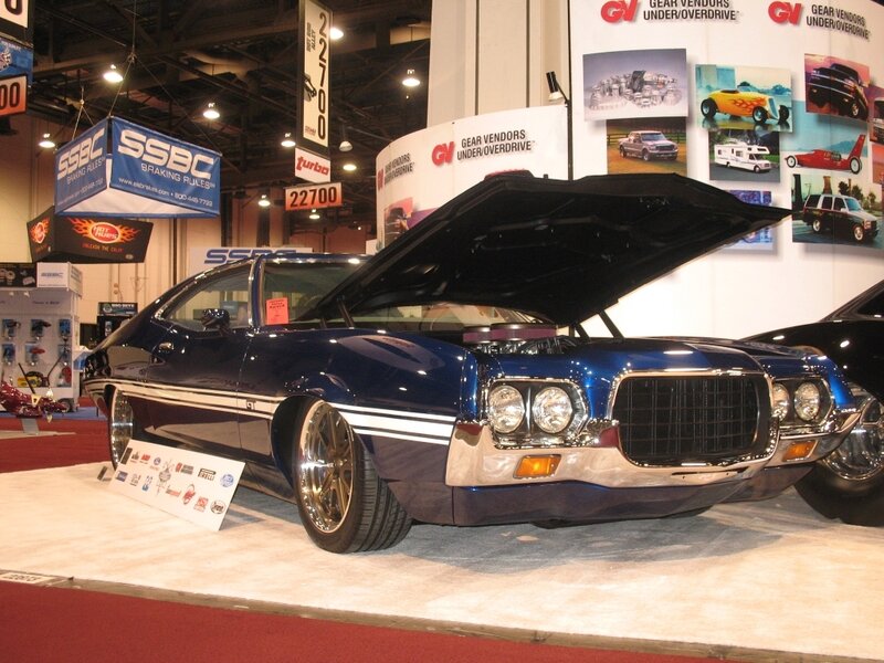 blue classic car at auto show