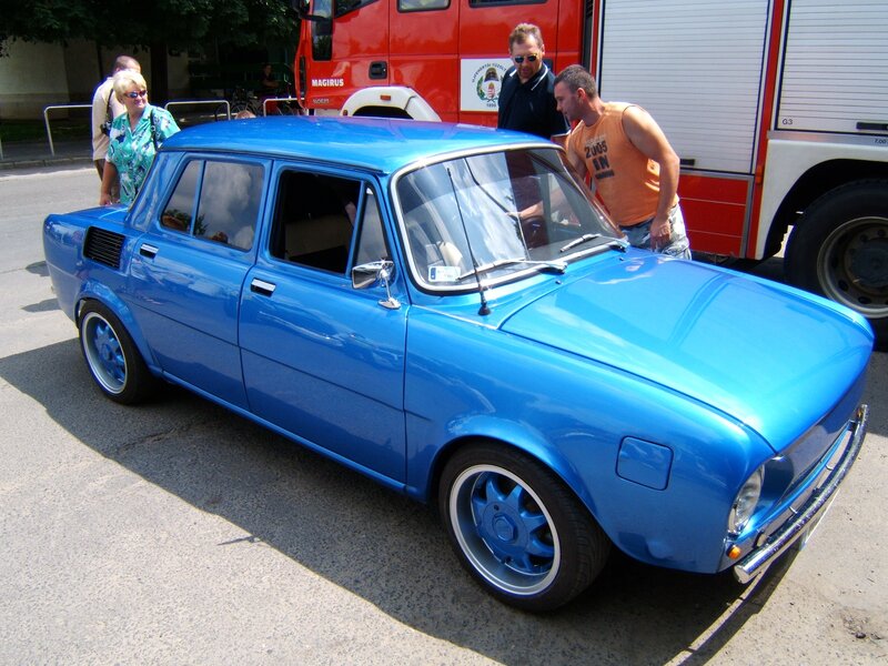 Blue classic car at outdoor event