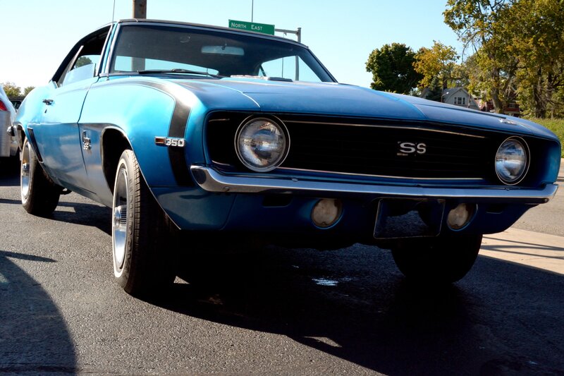 Blue Classic Car — Bright, Afternoon, Photograph, Street Sign