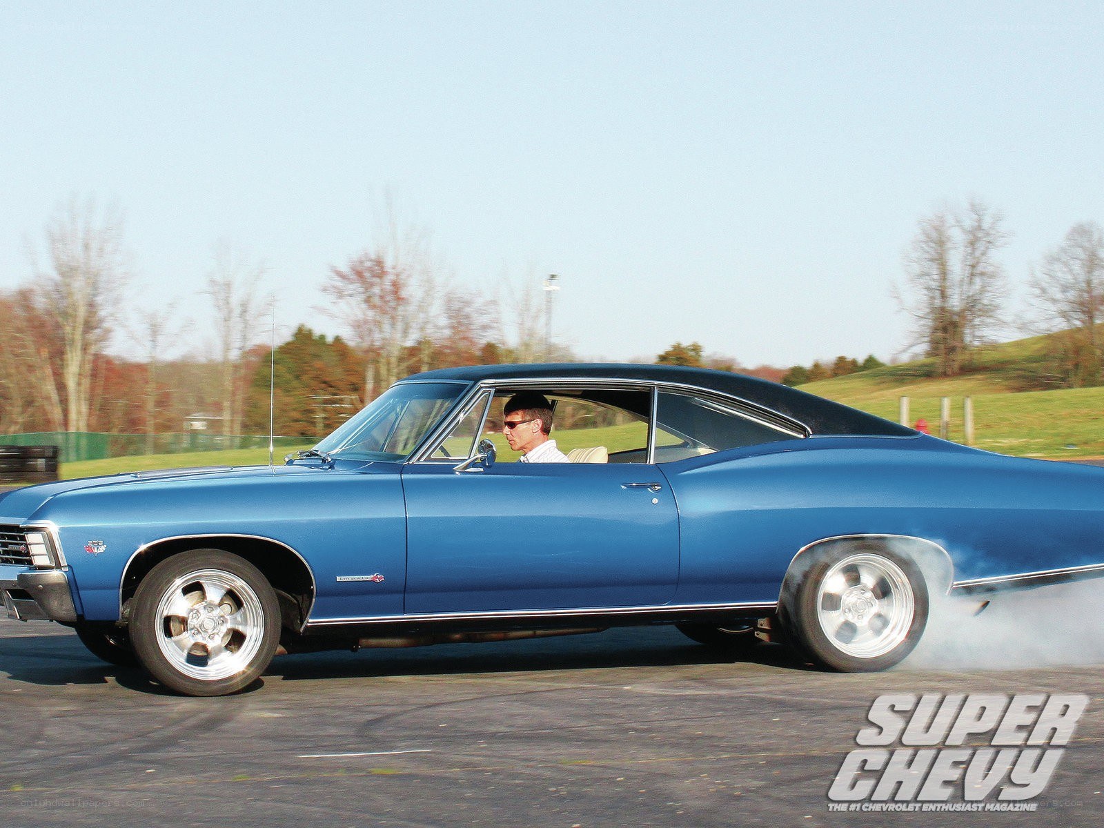 Blue classic car burnout