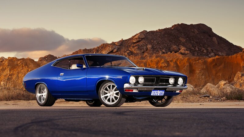 Blue Classic Car — Dramatic, Sunset, Photograph, Road, Mountain