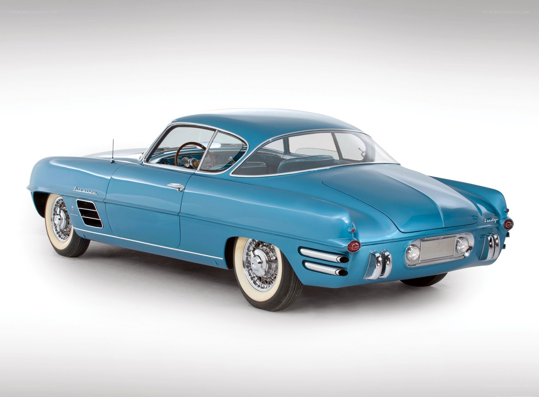 blue classic car from side rear