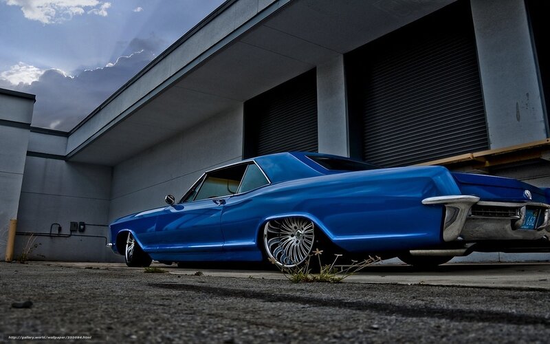 Blue classic car in alley