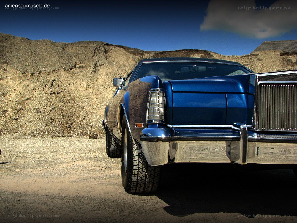 Blue classic car in desert