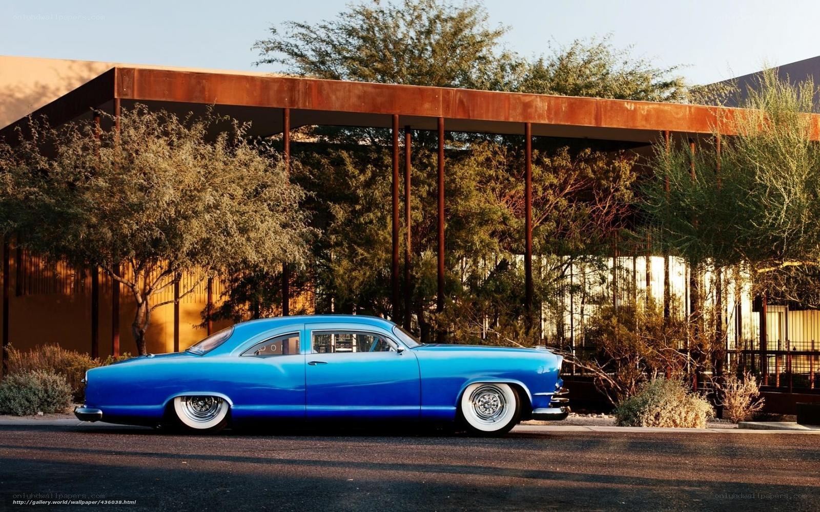 Blue classic car in desert