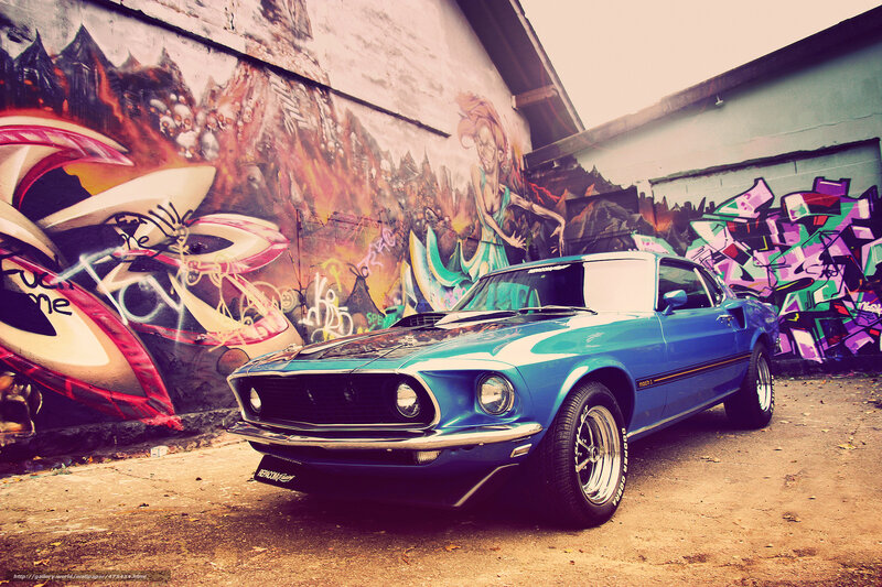 Blue classic car in graffiti alley