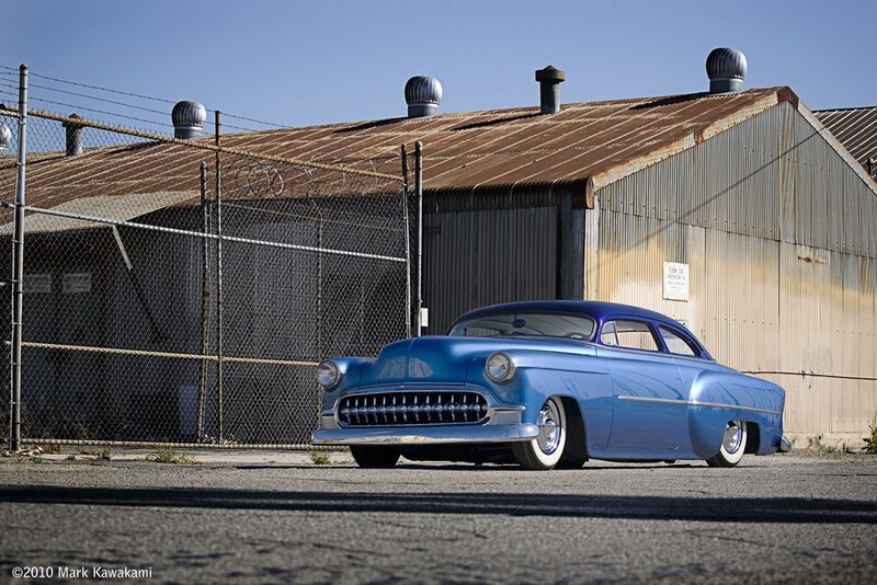 Blue classic car in industrial lot
