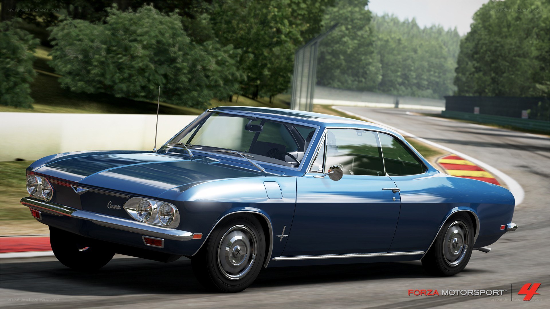 Blue classic car on a racetrack