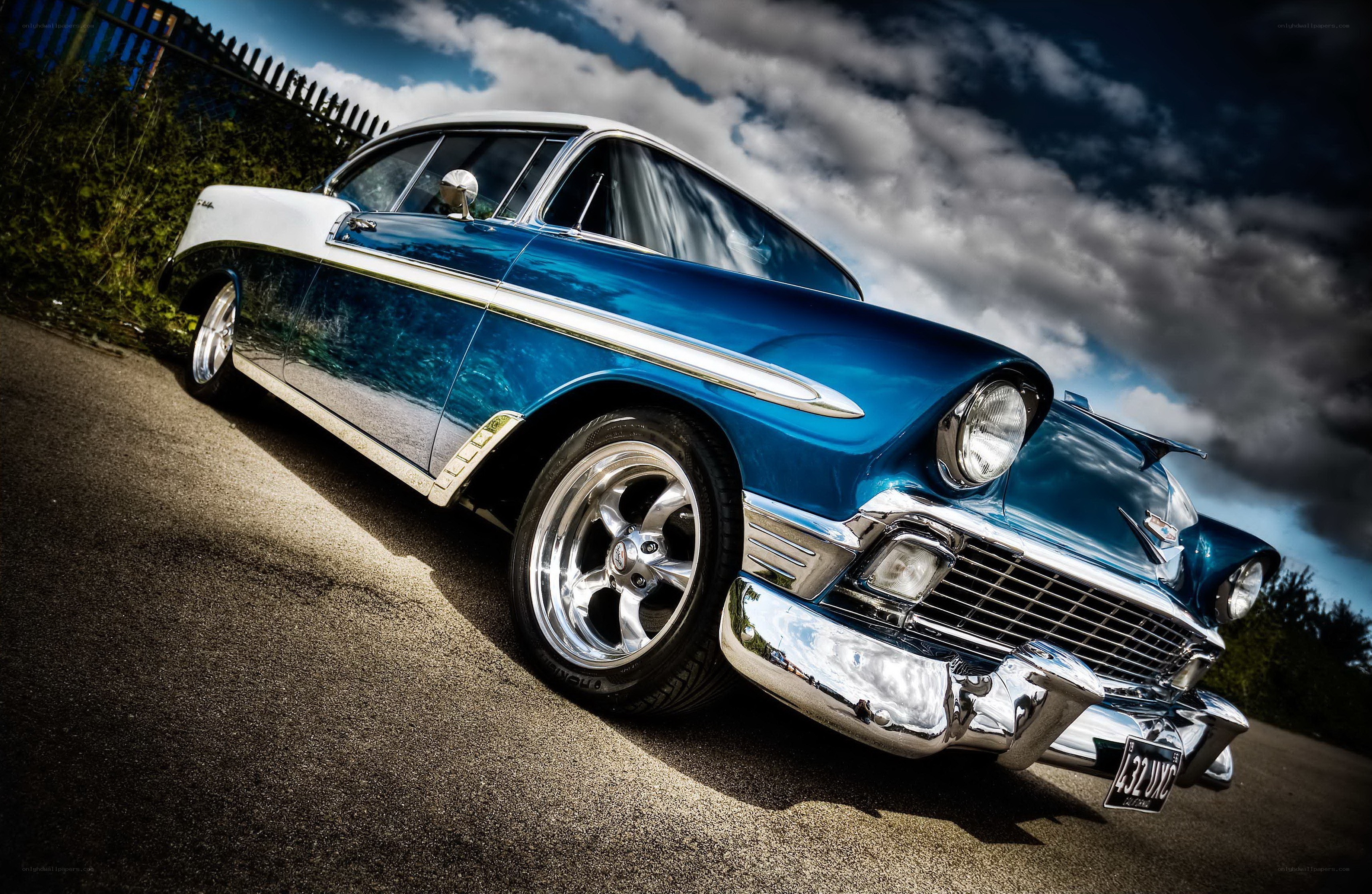 Blue classic car on asphalt