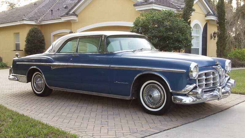 blue classic car on driveway