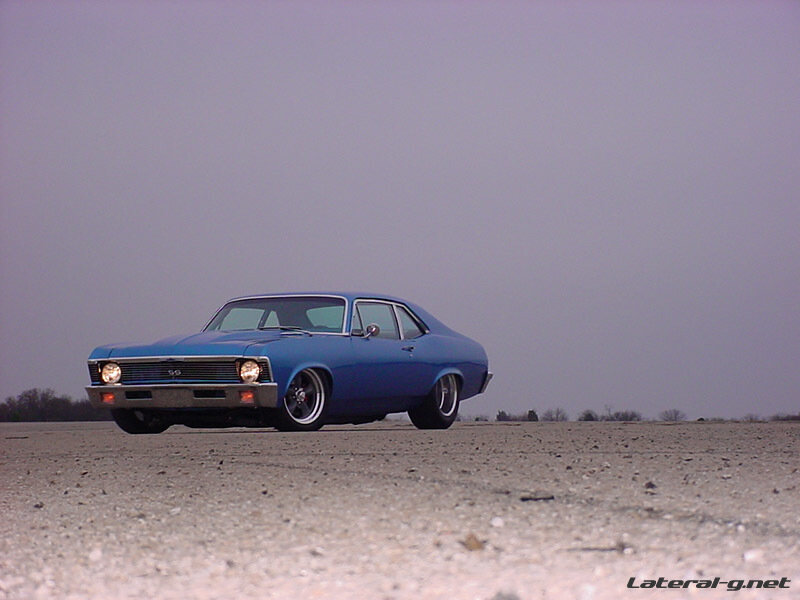 blue classic car on gravel