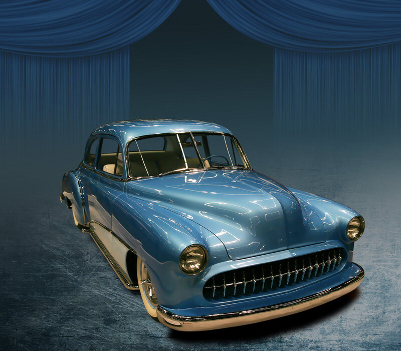 blue classic car on stage