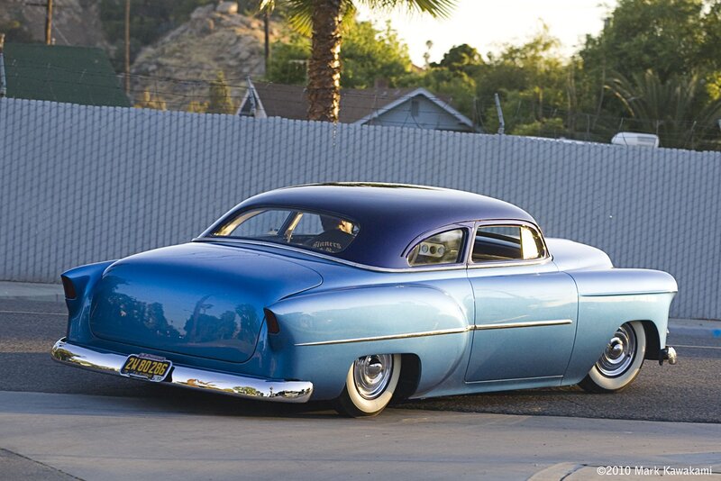 blue classic car on street