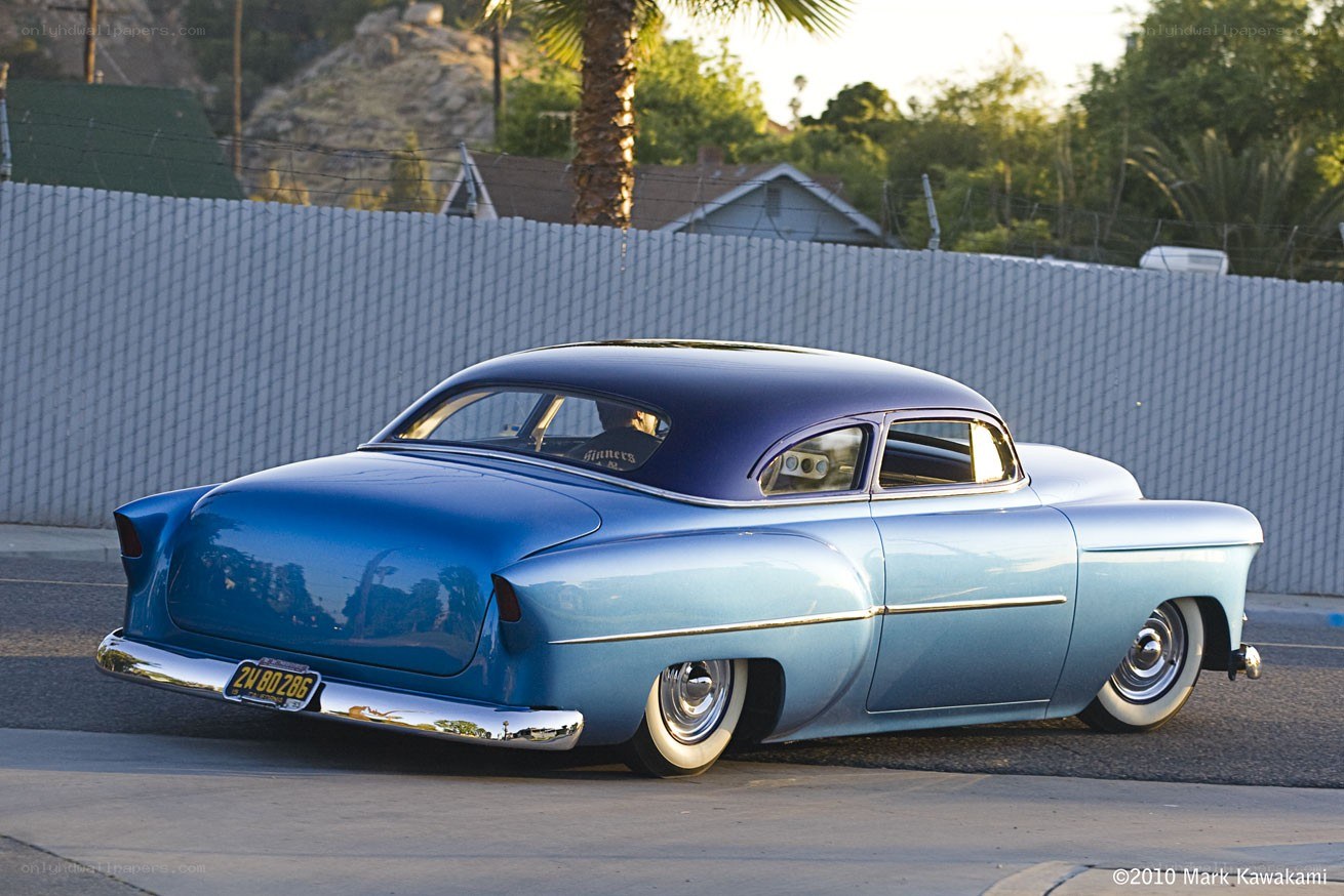 blue classic car on street