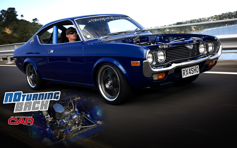 Blue classic car on the road
