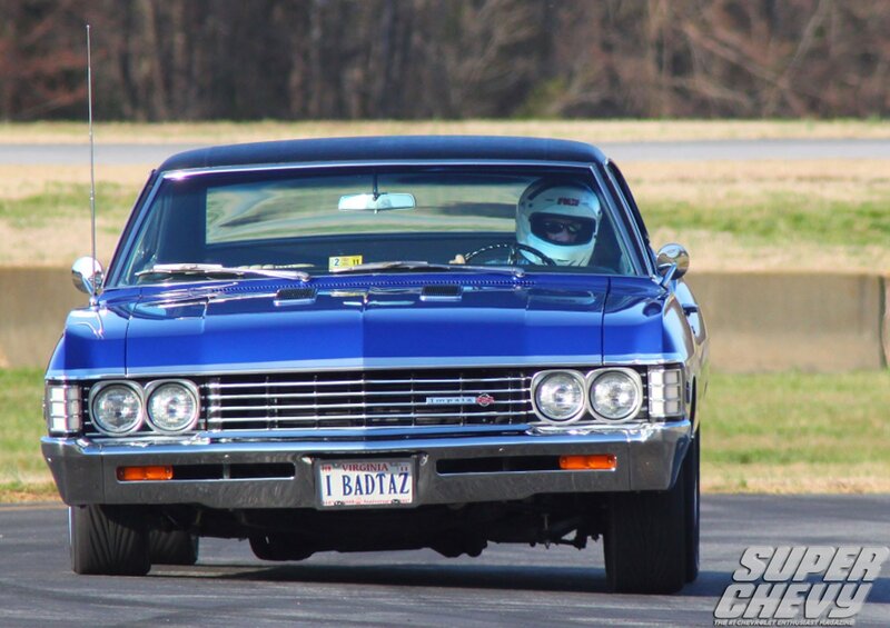 Blue classic car on track