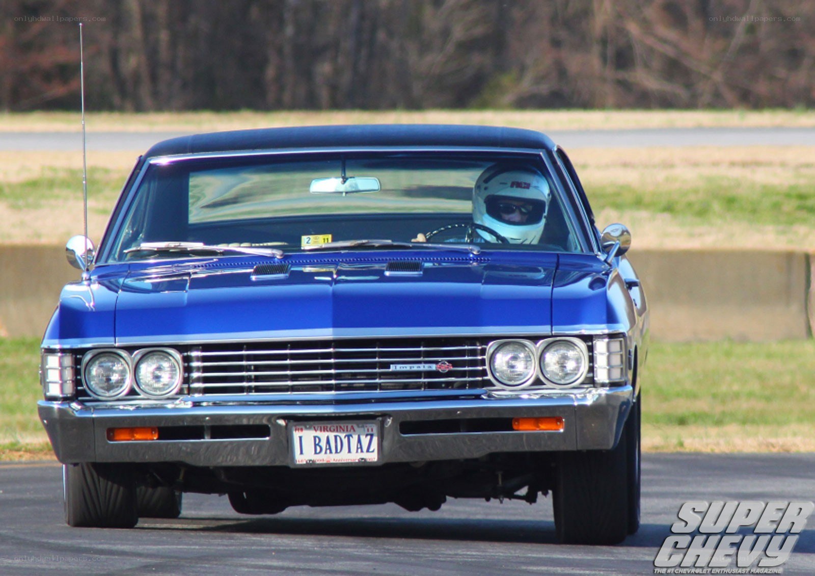 Blue classic car on track