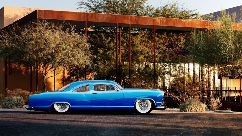 Blue Classic Car — Serene, Afternoon, Photograph, Building, Trees, Road