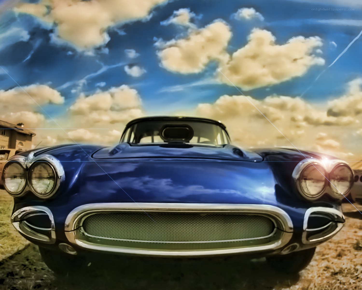 Blue classic car under cloudy sky