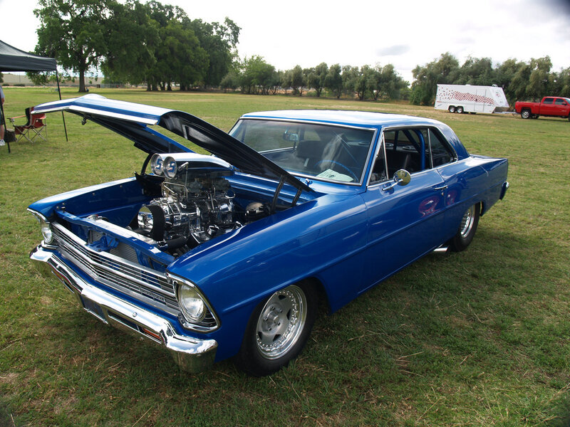 blue classic car with open hood