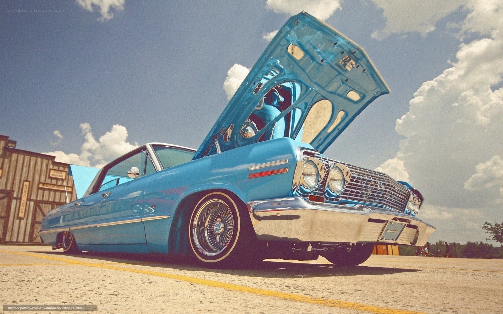 Blue classic car with open hood