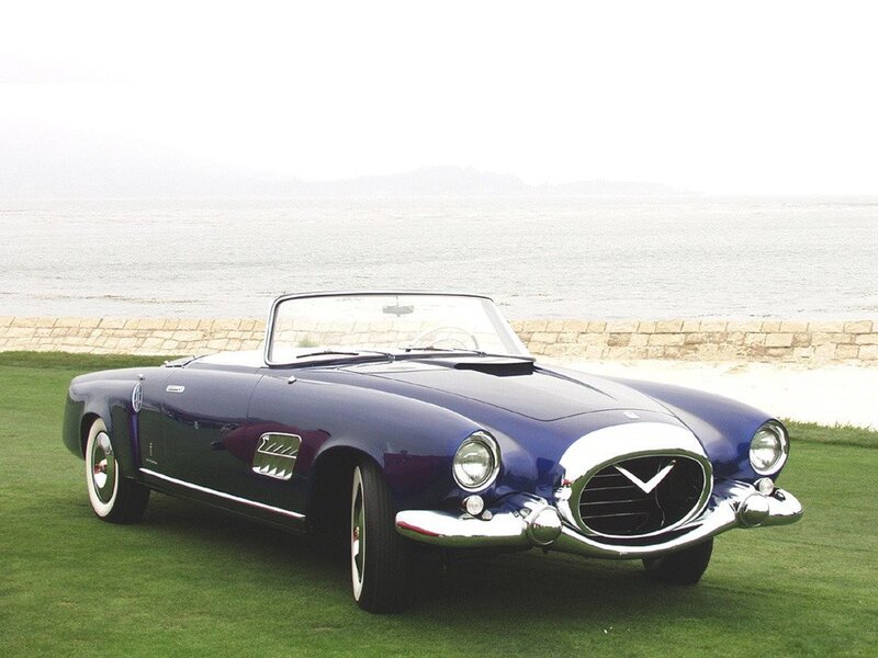 Blue classic convertible by the sea