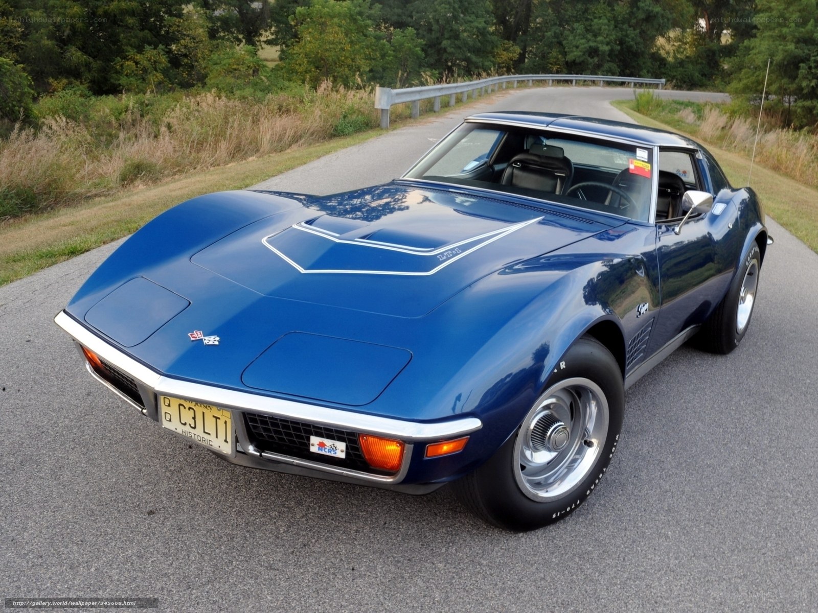 Blue classic Corvette on a road