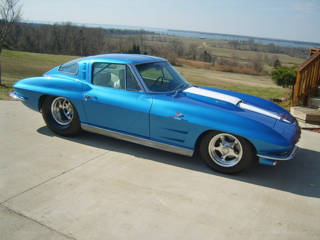Blue classic Corvette on driveway