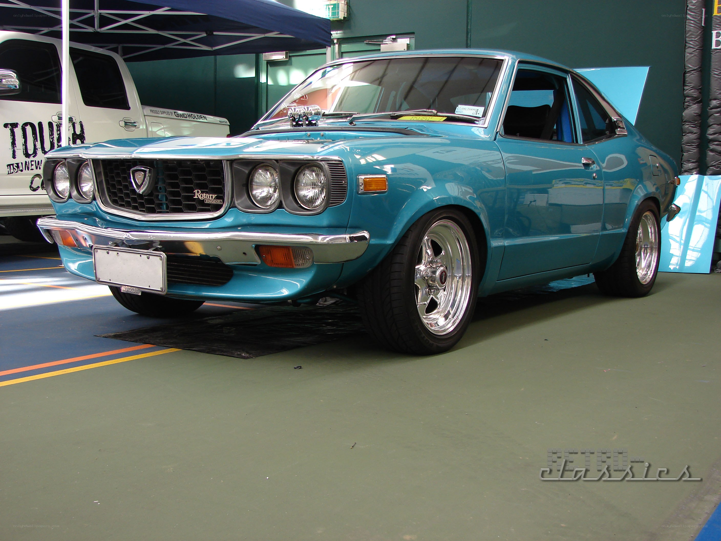 blue classic mazda coupe