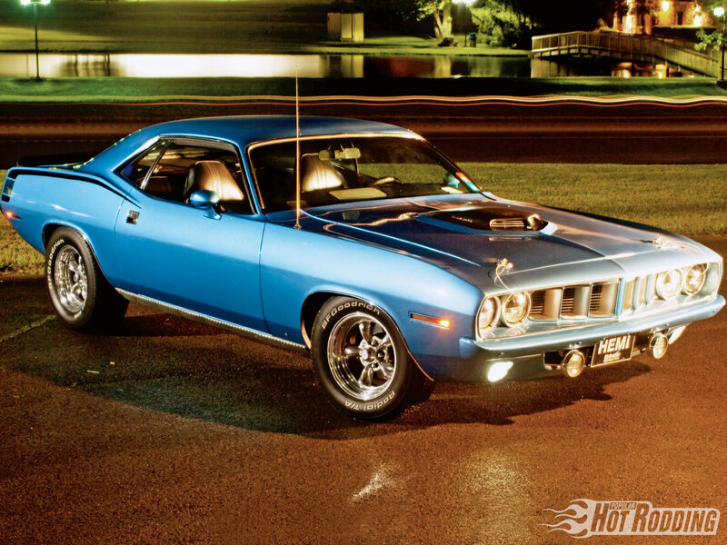 Blue classic muscle car at night