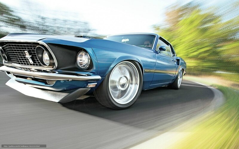 Blue classic muscle car in motion