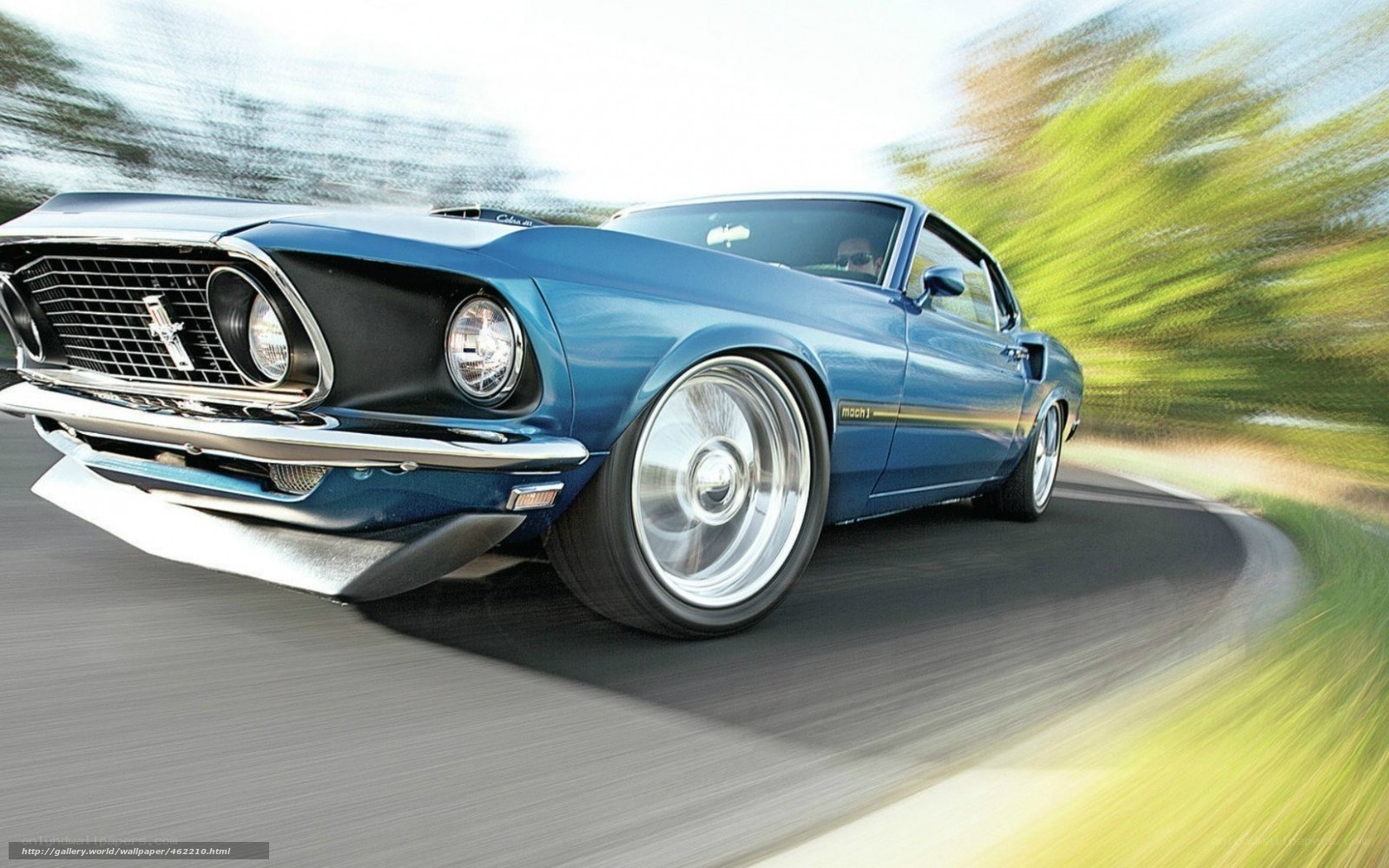 Blue classic muscle car in motion