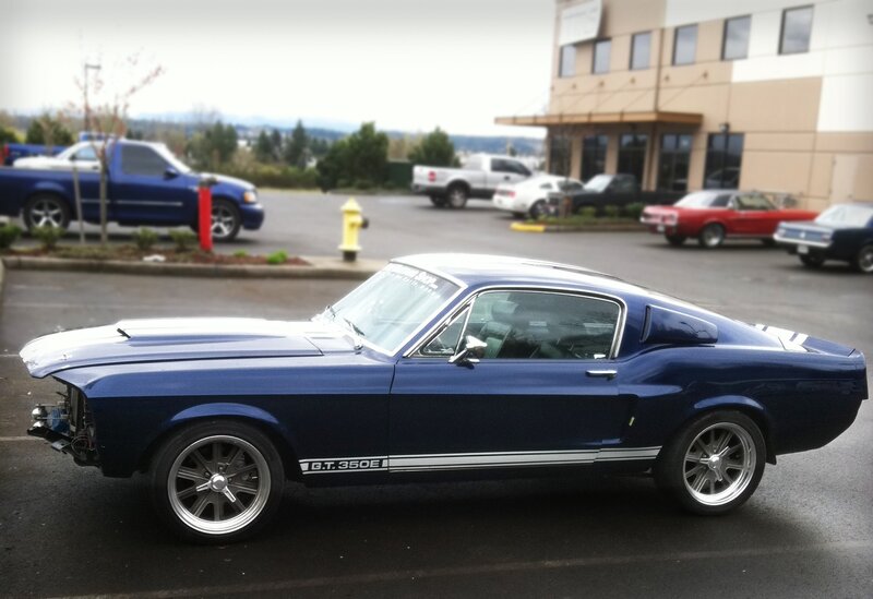 Blue classic muscle car in parking lot