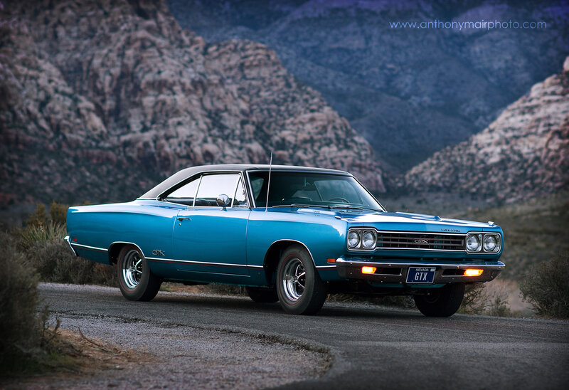 Blue classic muscle car on road