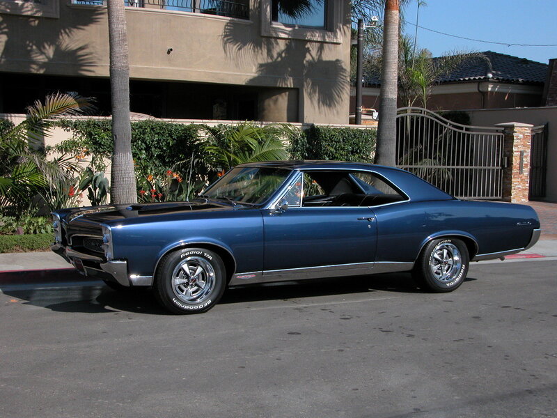 Blue classic muscle car on street